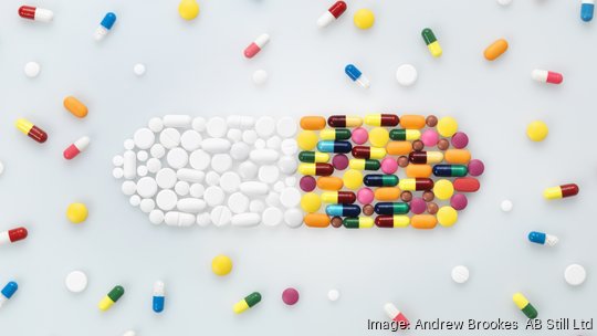 Medical pills and tablets in shape of drug capsule and scattered