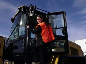 Shot Of Carley Climbing Into Loader