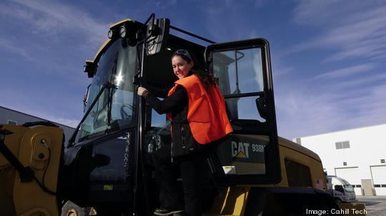 Shot Of Carley Climbing Into Loader