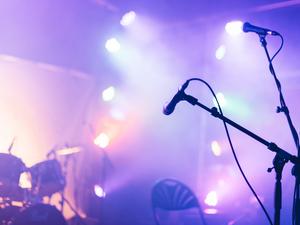 An illuminated concert stage - stock photo