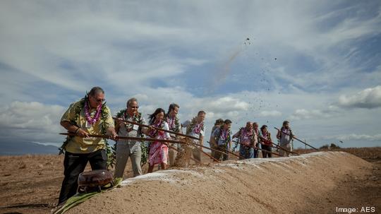 Turning of the earth using o‘o sticks. The first three people shown from left to right are Maui Mayor Michael Victorino, Bernerd Da Santos, Executive Vice President and Chief Operating Officer of AES, and Sandra Larsen, Hawaii Market Business Leader for A