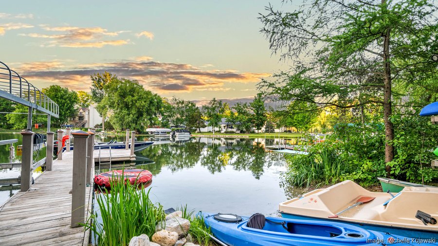 See West Bend lake house with an indoor pool, two saunas listed at 1