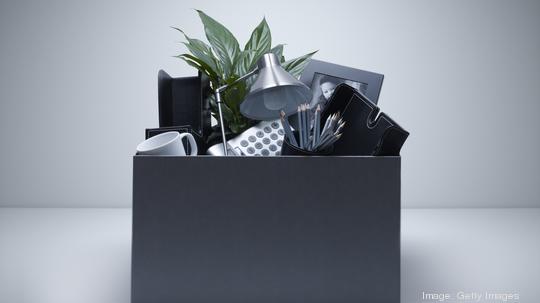 Box packed with desk objects