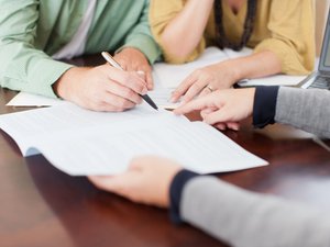 Couple signing contract