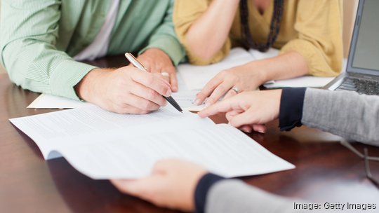 Couple signing contract