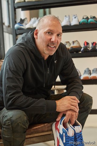 Reebok veteran is appointed CEO of Boston-based shoe and apparel giant
