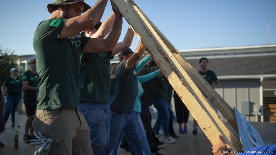 Volunteers raise a wall for a new Habitat for Humanity home in 2022. MIKE CHRISTEN / ABJ