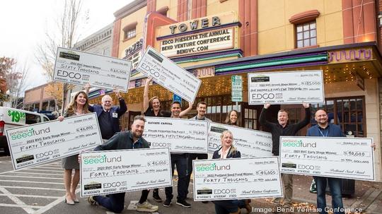 Seven winners with checks Bend Venture Conference 2022