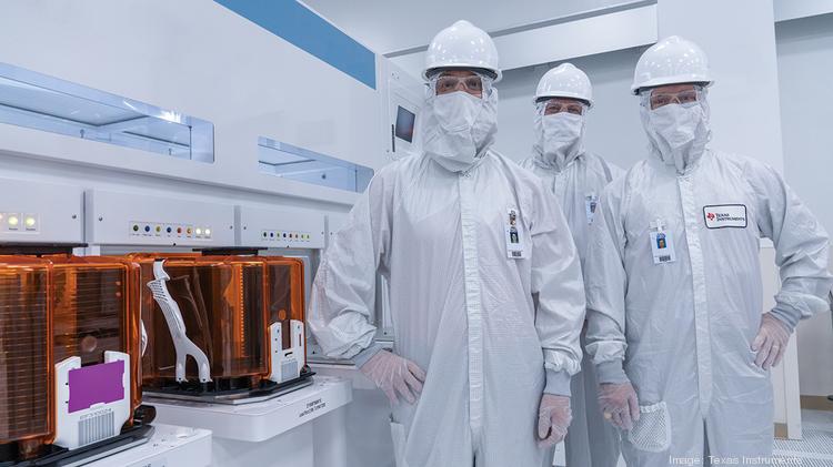 Employees in RFAB2 in Richardson. Initial production has begun in Texas Instrument's third and largest 300-millimeter wafer fab.