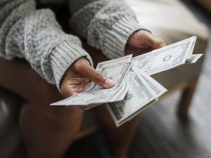 Closeup of woman counting money