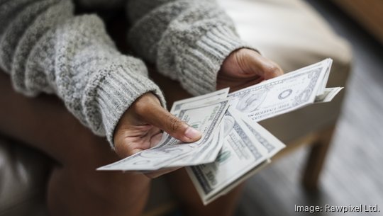 Closeup of woman counting money