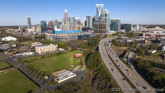 Aerial View of Charlotte, North Carolina on clear day showing highways and skyline