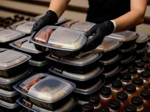 Lunch box with food in the hands. Catering