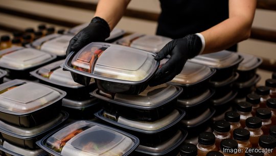 Lunch box with food in the hands. Catering