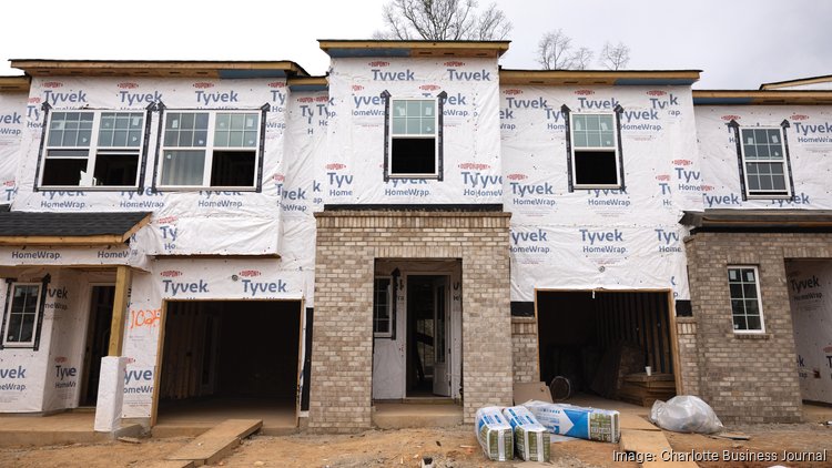 Modern farmhouse townhomes by Tri Pointe Homes are under construction in the Pergola neighborhood at Farmington.