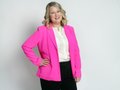 PSBJ 2023 40-Under-40 honoree Sarah Wilkins is pictured in the newsroom photo studio in Seattle