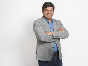 PSBJ 2023 40-Under-40 honoree Tushar Garg is pictured in the newsroom photo studio in Seattle