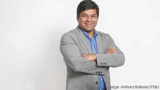 PSBJ 2023 40-Under-40 honoree Tushar Garg is pictured in the newsroom photo studio in Seattle