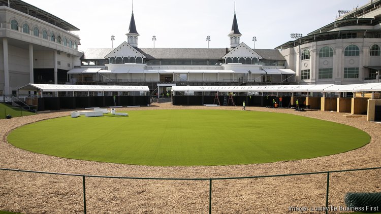 The Twin Spires are pictured above Calhoun Construction crews as they work to complete a temporary Paddock for use during the 149th Kentucky Derby at Churchill Downs.