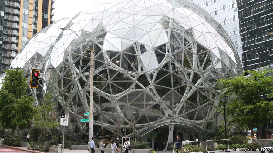 Amazon employees return to the company’s massive corporate headquarters sprawl in Seattle, Washington