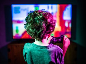 Little boy playing video game