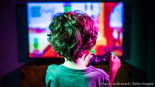 Little boy playing video game