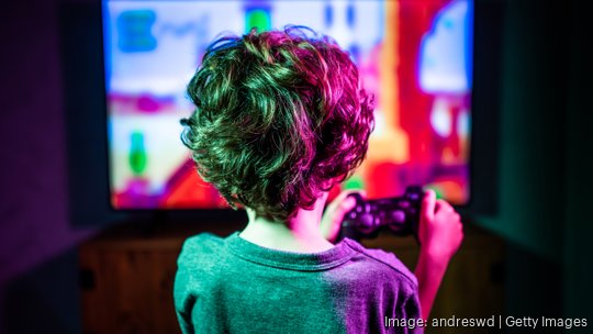 Little boy playing video game