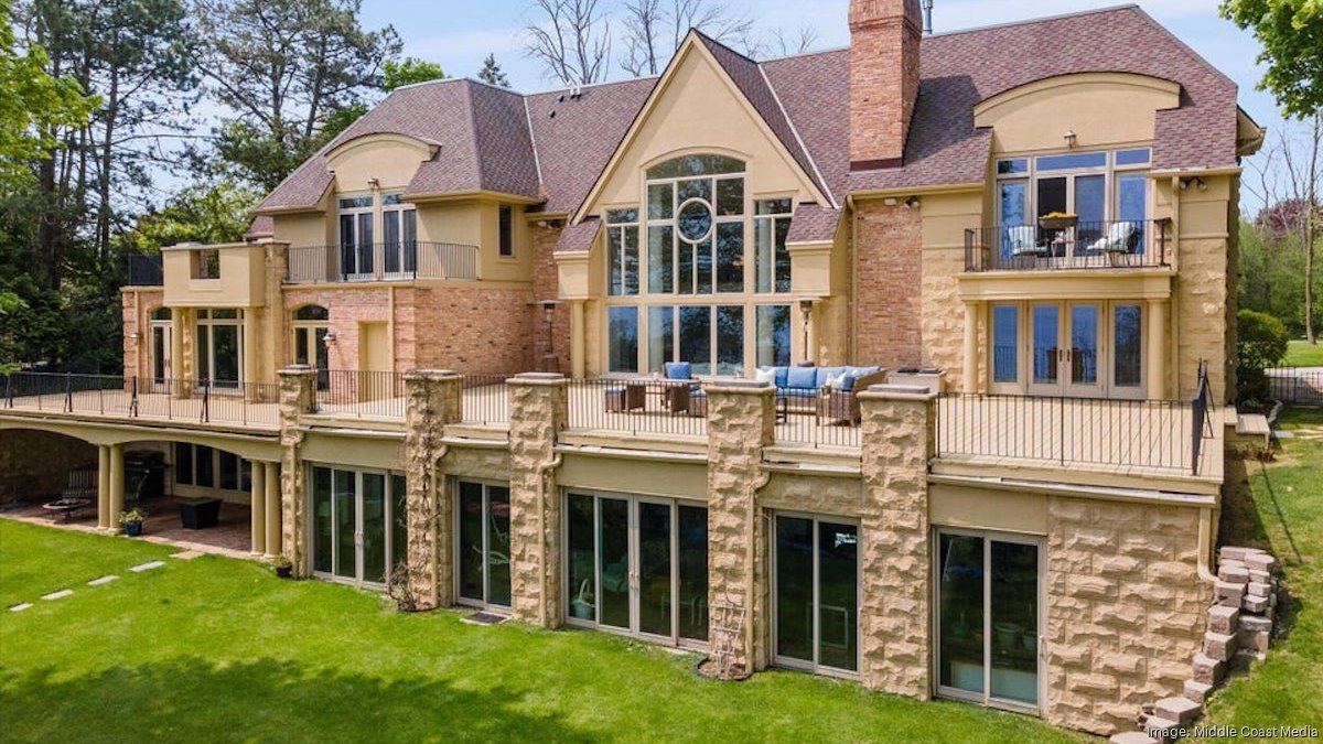 Lakefront home in Bayside with attached guest house listed for 2.5M