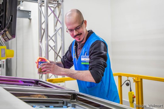 walmart associate sorting food in machine