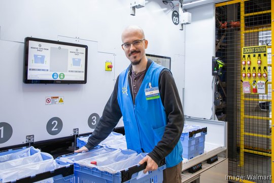 walmart associate placing crate