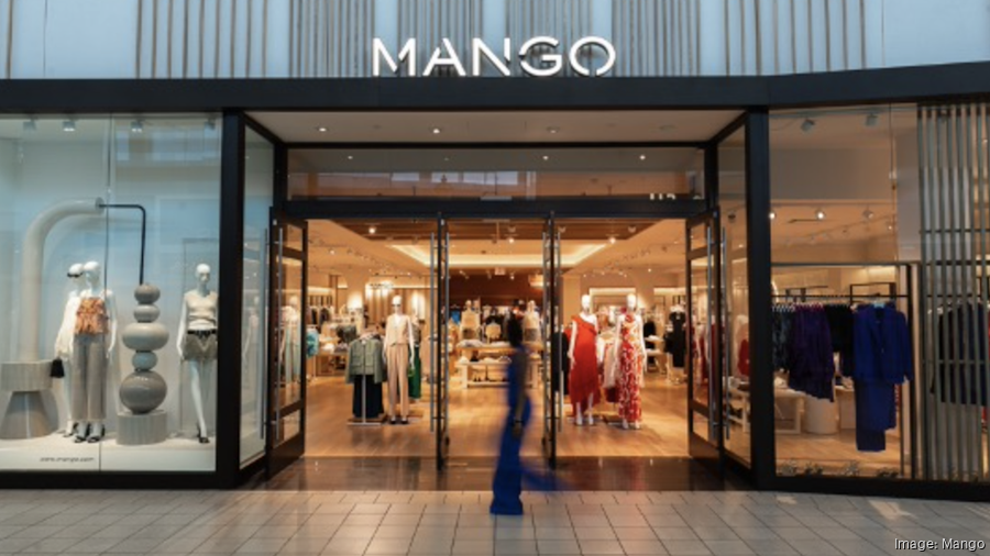 Modern Clothing Boutique Exterior with Large Window Display and