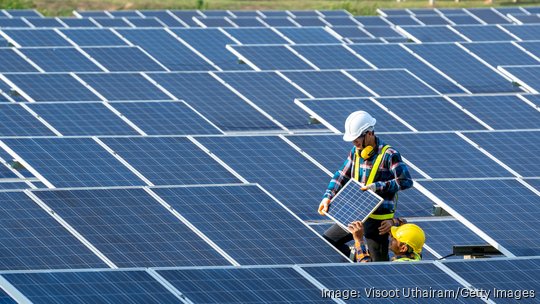 Electrician installing solar panels