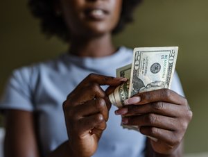 Close up of a woman counting money