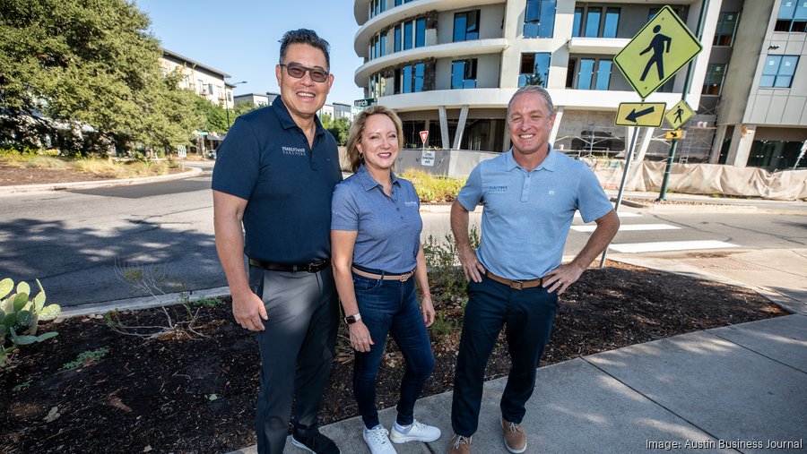 Pearlstone Partners CEO Robert Lee, Principal Emily Lee and President Bill Knauss stand outside Pearlstone's Parkside at Mueller development. The firm is seeking capital partners for three new condo projects it hopes to break ground on in the coming years. ARNOLD WELLS / ABJ