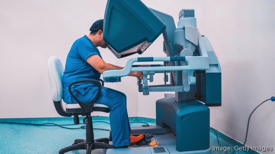 Surgeon performing robotic surgery