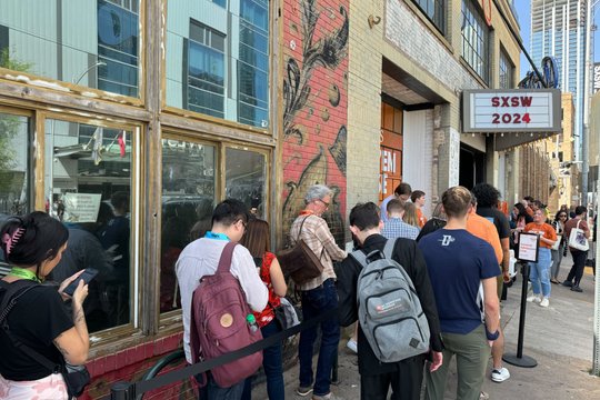 A line forms outside of the Hook 'Em House at Antone's on the first day of SXSW 2024