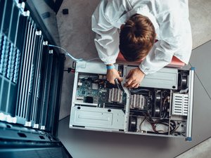 IT engineer servicing supercomputer equipment