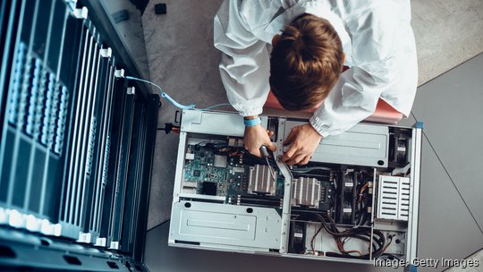 IT engineer servicing supercomputer equipment