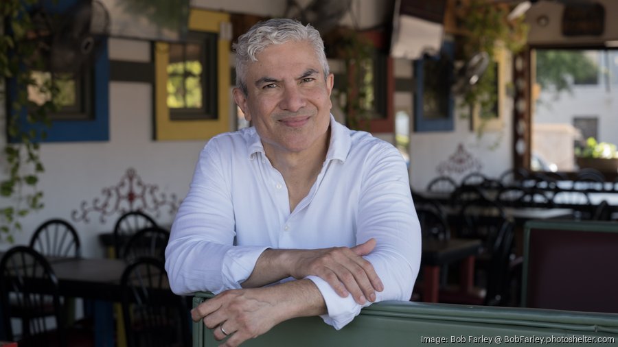 Margarita Grill owner Javier Jerez serving tacos, margaritas