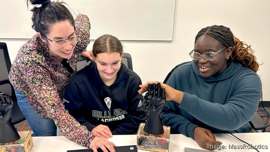 Jumpstart program manager Alethea Campbell with two students.