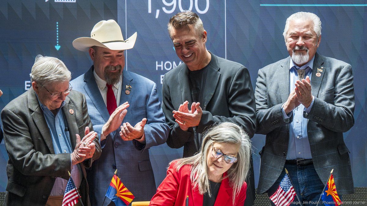 Axon CEO Rick Smith and Gov. Hobbs celebrate 'Axon bill' signing ...