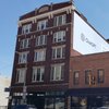 Downtown Microliving apartment building hits market as developer shifts focus