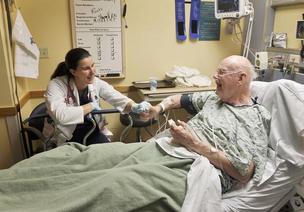 Dr. Flora Waples-Trefil talks with patient Kenneth Bensen of Westminster at the senior emergency department at Lutheran Medical Center in 2012. Bensen was admitted for observation because of weakness and fever.