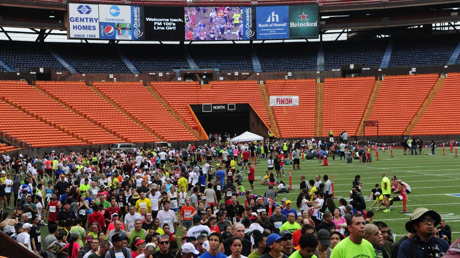 Great Aloha Run finishers gather on the field at Aloha Stadium in ...