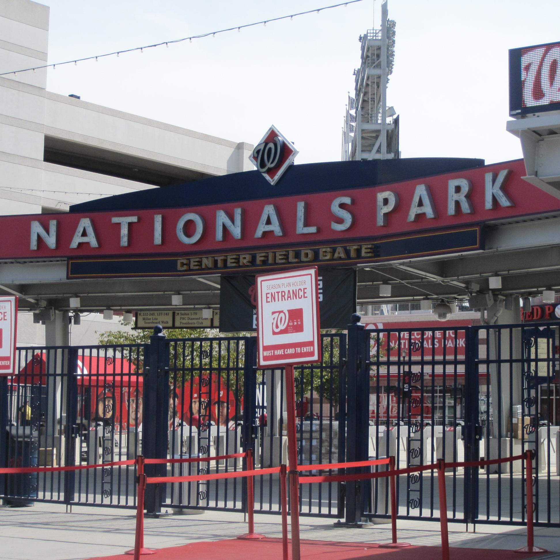 Washington Nationals' Bryce Harper (L) of the National League is awarded  the trophy by his father Ron Harper after winning the 2018 Home Run Derby  at Nationals Park in Washington, D.C. on