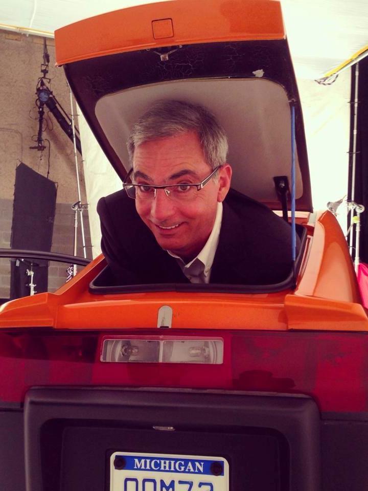 A file photo of Paul Elio, founder and CEO of Elio Motors in the trunk of one of his vehicles.