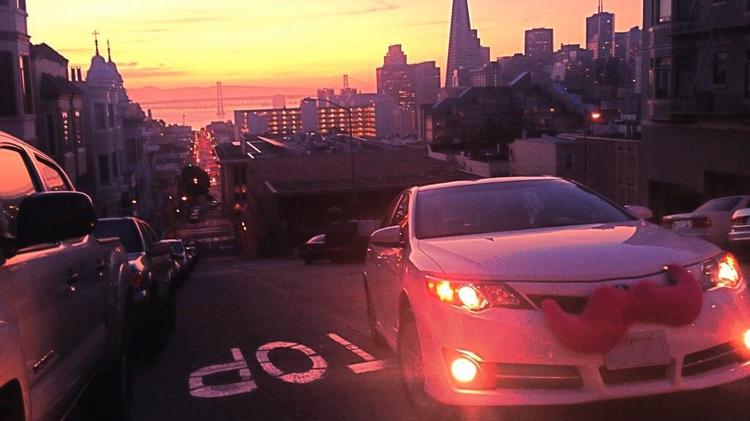 Lyft car making its way up a hill in San Francisco.