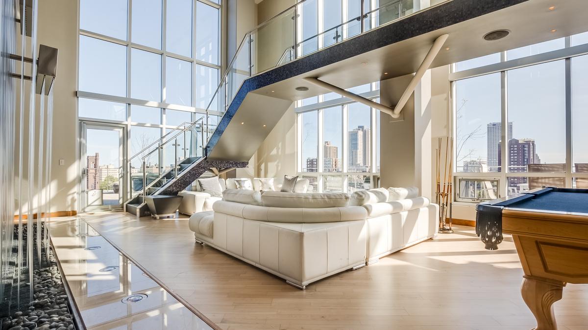 Downtown condo with its own waterfall back on market at lower price