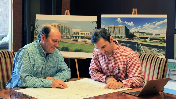 Ray Gill, principal of Gill Properties, (left) and Brown Gill, vice president of Gill Properties Inc. (right)